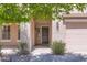 Close-up of the front entrance showing the door and surrounding landscaping at 28806 N 23Rd Ln, Phoenix, AZ 85085