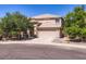 Inviting home with a two-car garage and desert landscaping under a clear blue sky at 28806 N 23Rd Ln, Phoenix, AZ 85085