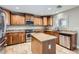 Well-equipped kitchen with an island, plenty of cabinet space, and stainless steel appliances at 28806 N 23Rd Ln, Phoenix, AZ 85085