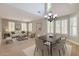 Bright living room with modern furniture, neutral tones and large windows with plantation shutters at 28806 N 23Rd Ln, Phoenix, AZ 85085