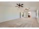 Expansive living area leads to bathroom, neutral walls, and plush carpeting throughout at 28806 N 23Rd Ln, Phoenix, AZ 85085