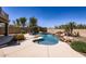 Beautiful pool area featuring a rock waterfall, mature landscaping, and ample privacy at 28806 N 23Rd Ln, Phoenix, AZ 85085