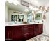 Well-lit bathroom with dual sinks, framed mirrors and stylish accents, ideal for modern living at 2944 N Brighton --, Mesa, AZ 85207