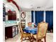 Charming dining area with a round table, ornate chairs, and easy access to the kitchen at 2944 N Brighton --, Mesa, AZ 85207