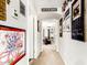 Inviting hallway featuring decorative art and an arched doorway leading to the Primary bedroom at 2944 N Brighton --, Mesa, AZ 85207