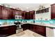 Well-equipped kitchen with stainless steel appliances, granite countertops, ample cabinetry, and a stylish tile backsplash at 2944 N Brighton --, Mesa, AZ 85207