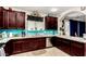 Modern kitchen featuring sleek cabinetry, granite countertops, stainless steel appliances, and a stylish backsplash at 2944 N Brighton --, Mesa, AZ 85207