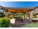 Community pavilion features a charming tile roof, wood ceiling, and picnic tables at 2944 N Brighton --, Mesa, AZ 85207