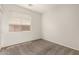 Carpeted bedroom with a large window for lots of natural light at 29919 N Little Leaf Dr, San Tan Valley, AZ 85143