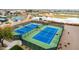 Aerial view of well-maintained tennis courts, part of a community recreational complex at 29919 N Little Leaf Dr, San Tan Valley, AZ 85143