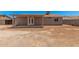 Expansive backyard featuring covered patio and desert landscaping, perfect for outdoor gatherings at 3056 N 68Th Ln, Phoenix, AZ 85033