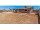 Spacious backyard featuring block fence, desert landscaping and covered patio, ready to create your private oasis at 3056 N 68Th Ln, Phoenix, AZ 85033