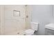 Modern bathroom with tile shower, updated fixtures, and neutral paint colors at 3056 N 68Th Ln, Phoenix, AZ 85033
