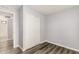 Bright bedroom features gray walls, wood-look floors and closet with sliding doors at 3056 N 68Th Ln, Phoenix, AZ 85033