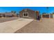 Image of a single story home that includes a desert landscape and a concrete driveway at 3056 N 68Th Ln, Phoenix, AZ 85033