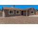 Charming single-story home with a desert landscape and neutral-tone exterior paint at 3056 N 68Th Ln, Phoenix, AZ 85033