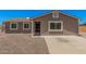 Charming single-story home with a desert landscape, covered entry, and a neutral-colored exterior at 3056 N 68Th Ln, Phoenix, AZ 85033