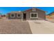 Charming single-story home featuring a desert landscape, concrete driveway, and neutral paint scheme at 3056 N 68Th Ln, Phoenix, AZ 85033
