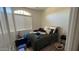 Bright bedroom with neutral walls, large window, and a comfortable bed at 3063 N Heritage St, Buckeye, AZ 85396