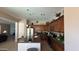 Spacious kitchen with a breakfast bar island, wood cabinets, and stainless steel appliances at 3063 N Heritage St, Buckeye, AZ 85396