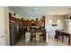 A cozy kitchen featuring dark wood cabinets, granite countertops and barstool seating at 3063 N Heritage St, Buckeye, AZ 85396