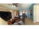 Inviting living room with leather furniture, a ceiling fan, and tile flooring at 3063 N Heritage St, Buckeye, AZ 85396