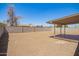 Large backyard area with covered patio and privacy wall at 3114 W Villa Maria Dr, Phoenix, AZ 85053