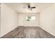 Bright and airy empty room with a large window for natural light and new modern flooring at 3114 W Villa Maria Dr, Phoenix, AZ 85053