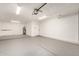Spacious garage featuring ample room, storage cabinets, and overhead lighting, ready for vehicles and projects at 3114 W Villa Maria Dr, Phoenix, AZ 85053
