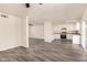 Open living space with a seamless transition to the kitchen with luxury vinyl plank flooring throughout at 3114 W Villa Maria Dr, Phoenix, AZ 85053