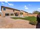 Large backyard with desert landscaping, artificial turf, a fountain, and a covered patio at 3423 E Superior Rd, San Tan Valley, AZ 85143