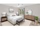 Well-staged bedroom with neutral tones, a bed with white linens, and an abundance of natural light at 3423 E Superior Rd, San Tan Valley, AZ 85143