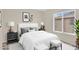 Well-lit bedroom with neutral paint, large windows, and contemporary decor at 3423 E Superior Rd, San Tan Valley, AZ 85143