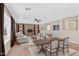 Open-concept living and dining area with a neutral color palette and ample natural light from large windows at 3423 E Superior Rd, San Tan Valley, AZ 85143