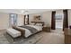 Serene bedroom features a large bed, soft lighting, and tasteful decor for a relaxing retreat at 3423 E Superior Rd, San Tan Valley, AZ 85143