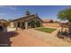 This home features a backyard with a privacy fence, a manicured lawn and gravel groundcover at 3905 E Derringer Way, Gilbert, AZ 85297
