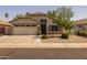 Charming single-story home featuring well-maintained landscaping and a two-car garage at 3905 E Derringer Way, Gilbert, AZ 85297