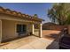 Covered patio with a bench and view of the fenced in backyard featuring a small grassy area at 3905 E Derringer Way, Gilbert, AZ 85297