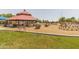 Community playground featuring climbing structures, a gazebo, and covered picnic tables at 3905 E Derringer Way, Gilbert, AZ 85297