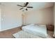 Neutral bedroom featuring carpet, ceiling fan, and natural light, creating a serene and inviting atmosphere at 3916 S 79Th Ln, Phoenix, AZ 85043