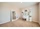 Bright bedroom featuring a vanity area, ideal for makeup and dressing, complemented by natural light at 3916 S 79Th Ln, Phoenix, AZ 85043