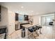 Bright kitchen featuring a granite island with seating, stainless steel appliances, and an open layout at 3916 S 79Th Ln, Phoenix, AZ 85043