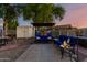 Charming backyard featuring a comfortable seating area, hot tub, and garden decorations in a private setting at 4013 E Delta Cir, Mesa, AZ 85206