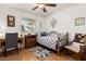 Bedroom with natural light, offering a comfortable space with desk and rocking chair at 4013 E Delta Cir, Mesa, AZ 85206
