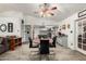 Cozy dining area adjacent to the kitchen, featuring a round table with black chairs and stylish wood-look tile flooring at 4013 E Delta Cir, Mesa, AZ 85206