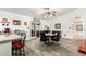 Bright dining area with a round table, modern chairs, and bar seating at the kitchen island, perfect for casual meals at 4013 E Delta Cir, Mesa, AZ 85206
