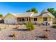 Charming single-story home with a well-maintained lawn, unique gazebo, and inviting front porch at 4013 E Delta Cir, Mesa, AZ 85206