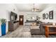 Cozy living room with a large sectional sofa, stylish decor, and plenty of natural light at 4013 E Delta Cir, Mesa, AZ 85206