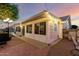 Bright sunroom with large windows, access to patio, and a charming, well-lit exterior at 4013 E Delta Cir, Mesa, AZ 85206