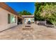Entertain guest in the backyard featuring a stone firepit, outdoor kitchen, and covered patio at 4037 E Elmwood St, Mesa, AZ 85205